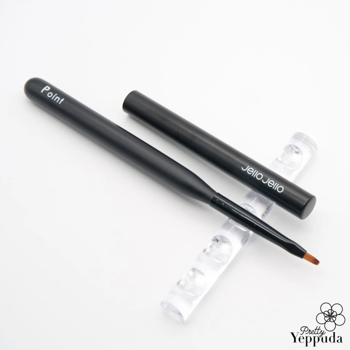 A set of flexible makeup brushes in a sleek, modern design with the brand name "JELLO JELLO" clearly displayed. The brushes appear to have a matte black finish, offering a stylish and professional look for effortless application of various cosmetic products.