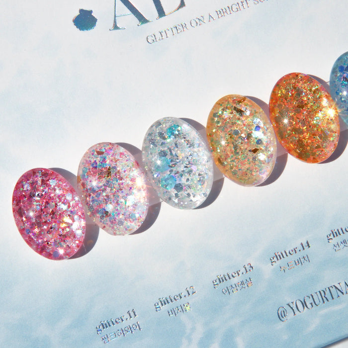 Vibrant and sun-kissed nail polish collection showcasing a range of tropical glitter gel colors, from sparkling blues to captivating tropical pinks, capturing the essence of a radiant Aloha spirit.