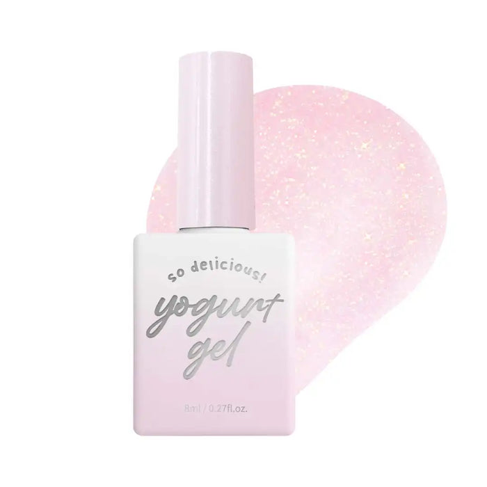 Delightful pastel pink gel polish with a subtle shimmering finish, perfect for creating a charming and refined nail look. The Yogurt In The Mood For Love Collection by [Brand Name] offers a set of dazzling glitter gels that can be layered over a base color for a beautiful, tonal effect. This nail gel is designed to provide a high-shine result while enhancing the tone of the underlying color.