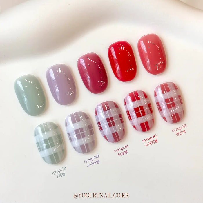 Vibrant autumn-inspired gel nail designs featuring a variety of warm, comforting colors reminiscent of freshly baked gingerbread. The collection showcases a harmonious blend of rich reds, cozy greys, and delicate pastel hues, evoking the mellow, inviting atmosphere of the autumn season. The intricate pattern work adds a touch of elegance and sophistication to this Shopify product, the "YOGURT Ginger Bread Collection 10pcs/set".