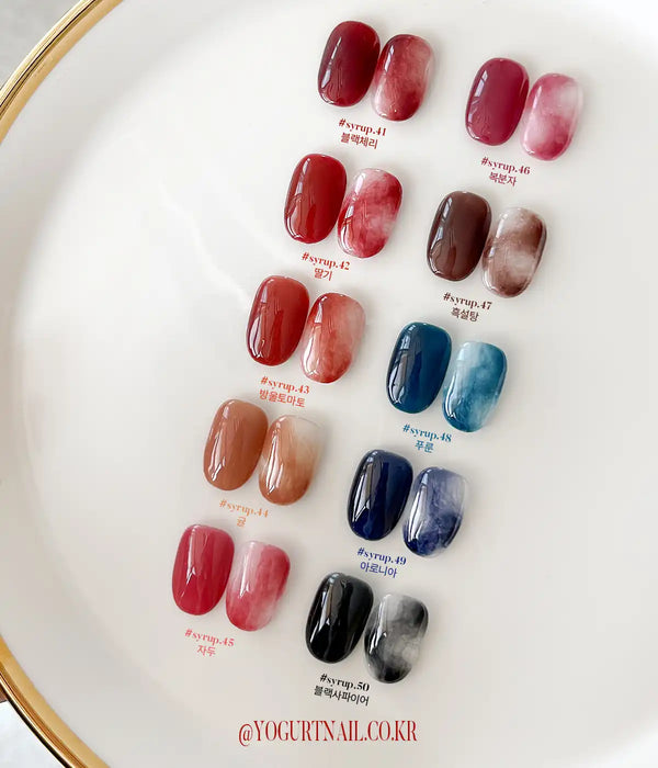 A vibrant array of gel nail polish samples, ranging from deep burgundy and crimson to soft pinks and blues, showcasing the diverse "Yogurt Tanghulu Collection" shades available. The image highlights the self-leveling formula and curing instructions for this Shopify product, providing customers with a comprehensive view of the color options and product details.