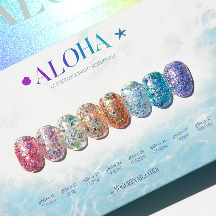 Vibrant and tropical gel glitter polish collection from the Yogurt Aloha product line, featuring an array of sun-kissed hues and long-lasting wear. The image showcases the colorful nail polish shades and collection details.