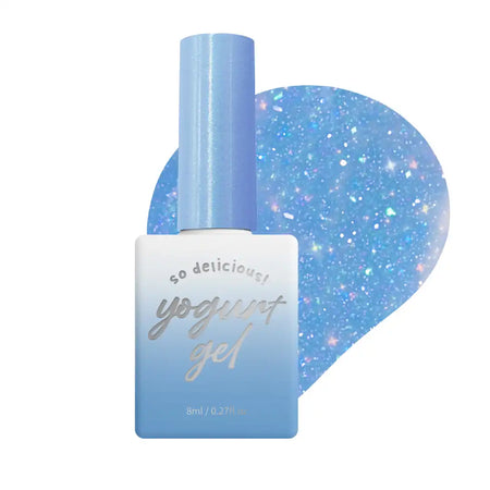 Detailed Alt Text: "A shiny and glittery blue nail polish bottle from the 'Yogurt In The Mood For Love 2 Collection' by Yogurt Nail Kr. The bottle has a light blue lid and the label displays the product name 'Yogurt Gel' in a playful, cursive font. The background is a soft, pastel blue with sparkling accents, creating a delightful and whimsical winter wonderland-inspired setting.