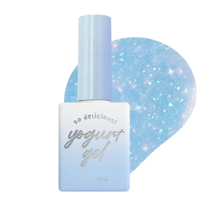 Enchanting blue bottle of Yogurt nail polish with sparkling glitter effects, capturing the alluring essence of the "In the Mood for Love 2" collection. This stylish and versatile gel polish adds a radiant, twinkling touch to nails, enhancing their natural beauty. The image conveys the luxurious and captivating nature of this Yogurt brand product.