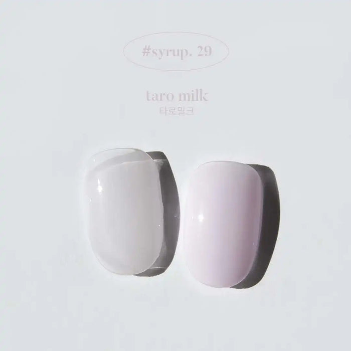 A pair of gelato-inspired nail polish bottles in soft pastel colors, showcasing the "YOGURT Gelato Collection" from the Shopify brand. The bottles feature a clean, minimalist design with the product name and color information displayed prominently.