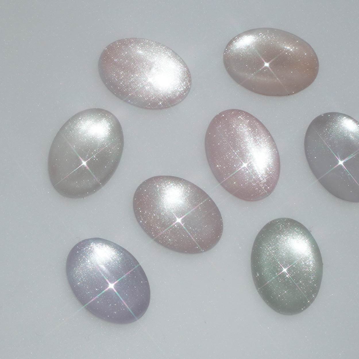 Star-shaped gemstones on a light gray background
