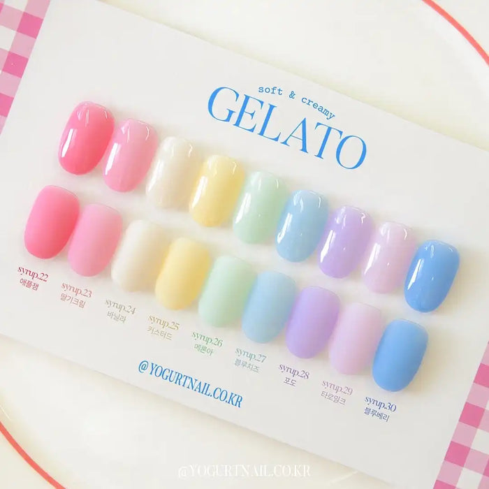 Colorful and vibrant palette of soft, creamy gelato-like nail polish shades, showcasing a range of pastel hues from pink to purple, blue, and yellow. The image displays the "Yogurt Gelato Collection" branding, highlighting the collection's focus on a delightful, ice cream-inspired aesthetic for nail art enthusiasts. 

Keyword consideration: Shopify, Yogurt Gelato, nailcare, nail polish, pastel, manicure, cosmetics.