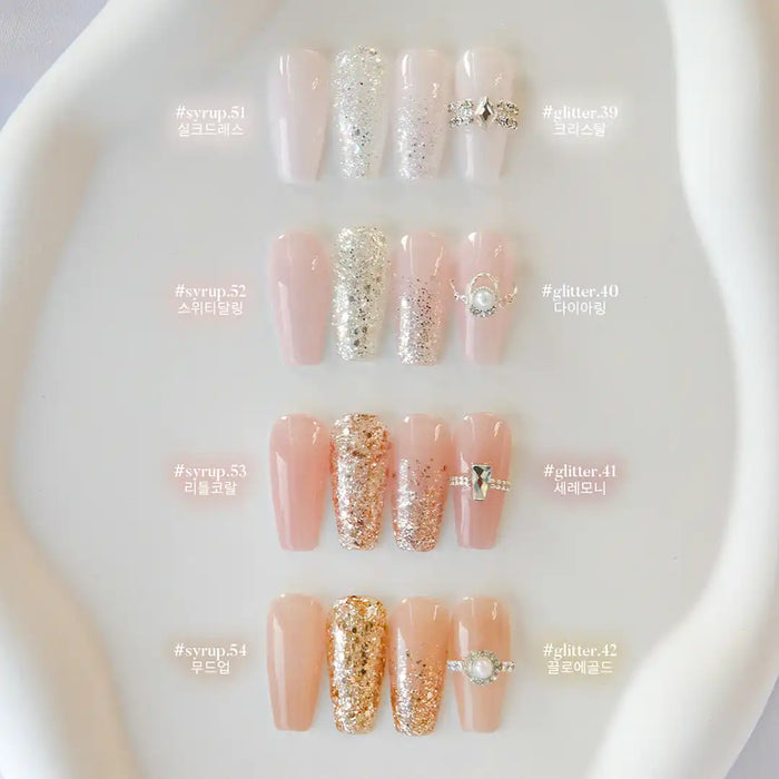 Elegant and sophisticated bridal nail designs featuring a soft color palette of pastel pinks and glistening gold glitters, ideal for brides and bridal shower celebrations.