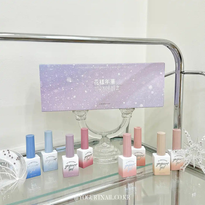 Elegant and enchanting winter wonderland-inspired nail polish collection featuring sparkling gel polishes in a variety of shades to enhance the natural beauty of your nails. Perfectly captures the mood and essence of the "Yogurt In The Mood For Love 2" Shopify product.