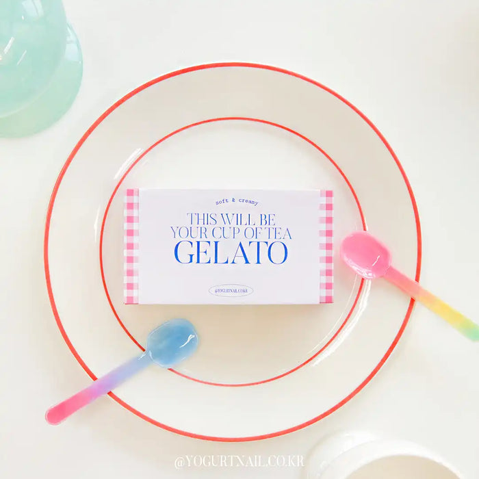 A colorful, minimalist image featuring a plate with red circular borders, a cup of pink gelato, and a label for the "Yogurt Gelato Collection" product. The label prominently displays the product name and indicates that the collection contains 9 piece syrup gels in a mid-viscosity formula, packaged in limited edition boxes with color charts for the user to complete. The image conveys a sense of playfulness and artisanal quality associated with the