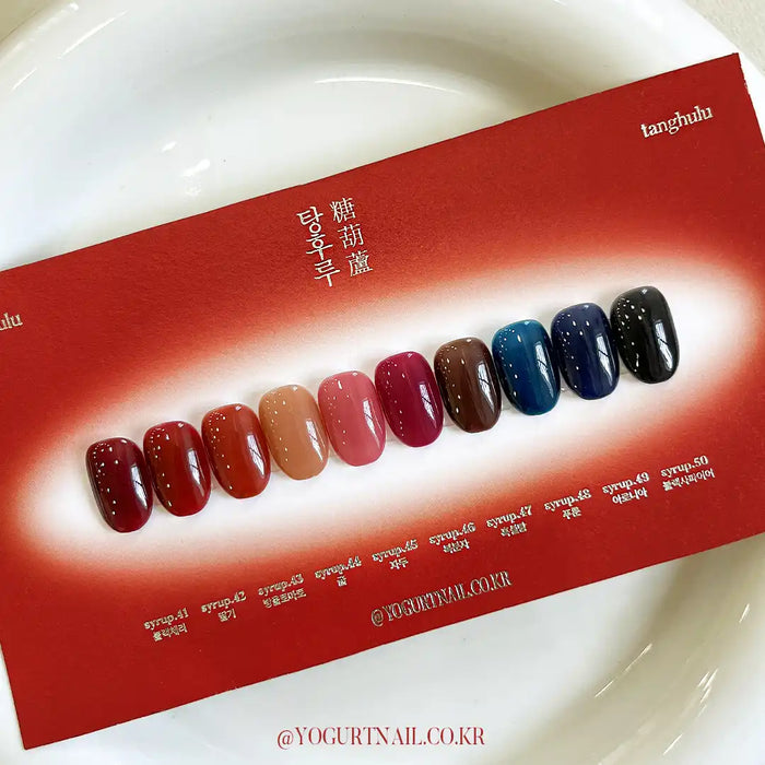 Deep, self-leveling syrup shades reminiscent of candied fruit in the Yogurt Tanghulu Collection. Available in a range of 10 rich, single gel colors to perfectly match the Tanghulu swatch card. Indulge in vibrant, long-lasting nail color with this 8ml Shopify product. Cure for 60s under UV/LED for a flawless, glossy finish.