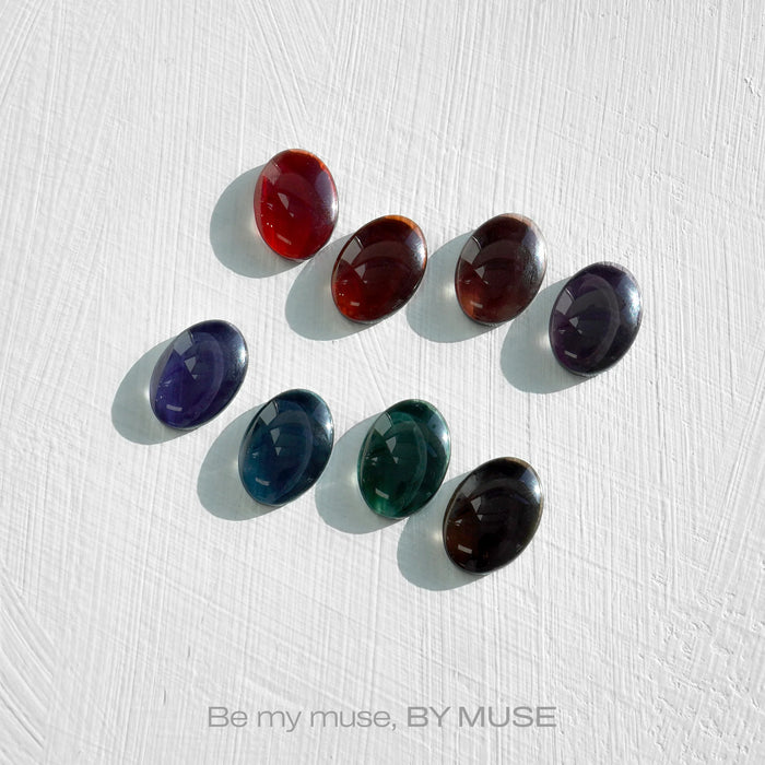 Vibrant, multi-colored gel nail polish collection by the brand ByMuse, featuring a set of 8 diverse hues in shimmering, high-shine finishes. The collection, titled 'Be My Muse', showcases a range of richly pigmented shades from deep plum to fiery red, perfect for expressing individual style and creativity.