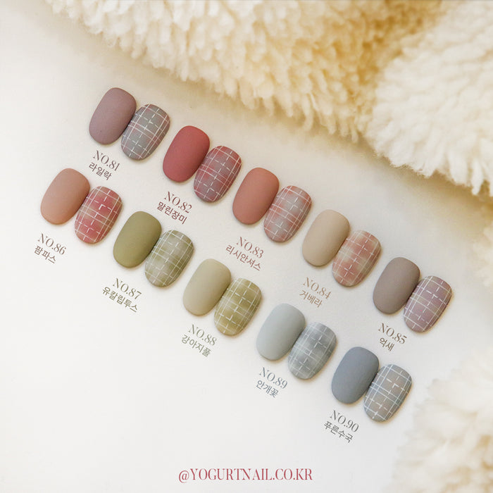 Vibrant and diverse collection of nail polish colors showcasing a wide range of earthy, neutral, and pastel shades, including muted reds, oranges, greens, and greys, arranged in a visually appealing grid layout. This image effectively highlights the extensive color options available in the "YOGURT Grocery set 90 colors" Shopify product.