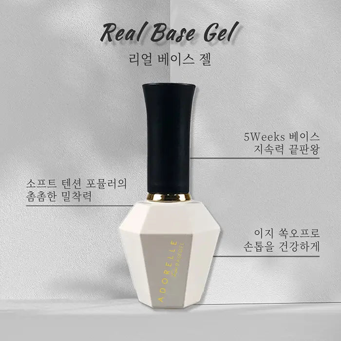 Elegant white and black nail gel bottle with gold accents, labeled 'Real Base Gel' in English and Korean. Product features highlighted in Korean text, emphasizing 5-week durability and soft texture. Sleek design suggests professional-grade quality for long-lasting manicures.