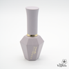 Elegant lavender nail polish bottle with geometric shape and gold accents, featuring Adorelle's signature design. Part of the Romantic Vintage collection, this 18ml bottle showcases a soft, muted color perfect for creating timeless and sophisticated manicures.