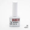 Elaborate alt text: The image depicts a white bottle labeled "AURORA QUEEN Stella Collection," which appears to be a Shopify product. The label features an artistic design inspired by the constellations, showcasing densely packed glitter gels that are designed to be shiny and easy to apply, creating a starry night effect. The product description mentions it is a set of 8 glitter gels with a volume of 9ml each, and includes round glass beads for s