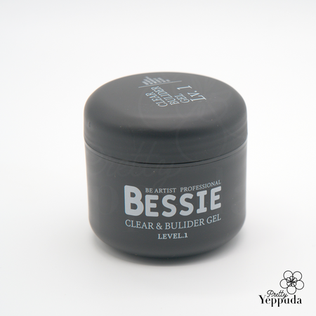 Sleek, dark gray container of Bessie Clear and Builder Gel Level 1 for professional nail artists. Compact jar with bold silver lettering showcasing the product name and type. Part of the extensive Bessie collection of single gels, designed for expert nail sculpting and enhancement.