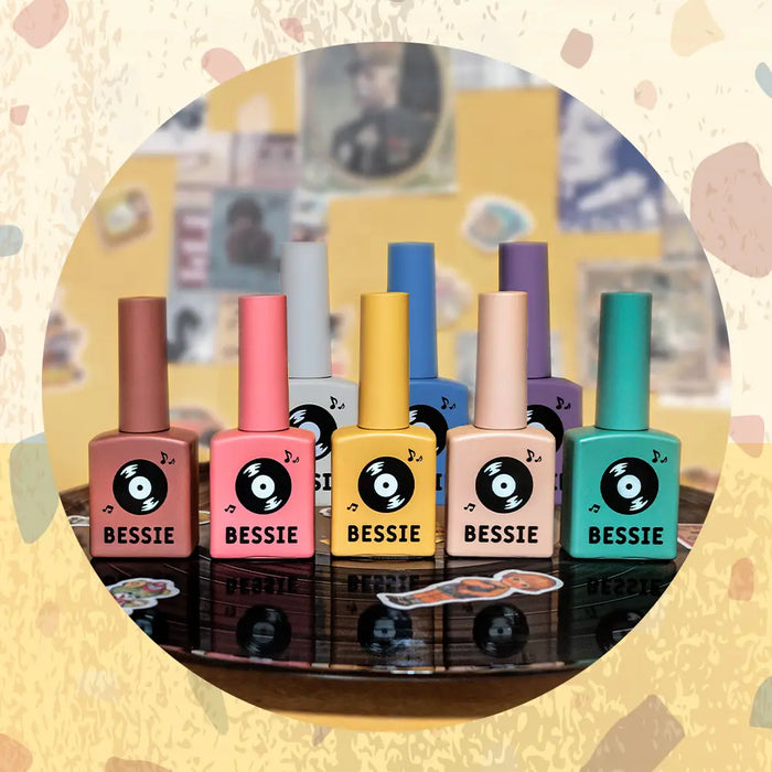 Vibrant colorful BESSIE nail polish bottles from the Old Pop Collection, showcasing a trendy and fun Fall-inspired palette. The set evokes a retro aesthetic that complements the seasonal color scheme, offering a versatile nail care solution for the discerning BESSIE customer.