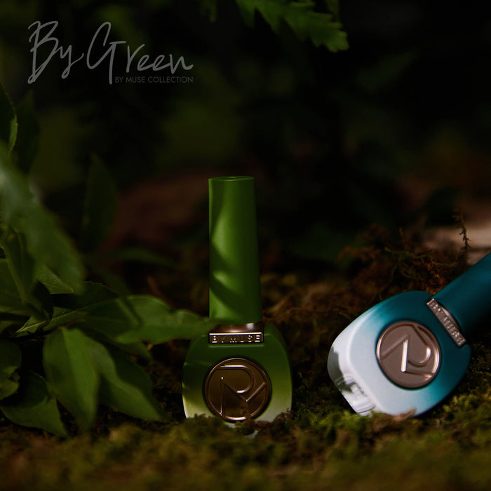 A mysterious forest-themed image featuring a green BY MUSE bottle from the "By Green" collection, set against a backdrop of moss and ferns.