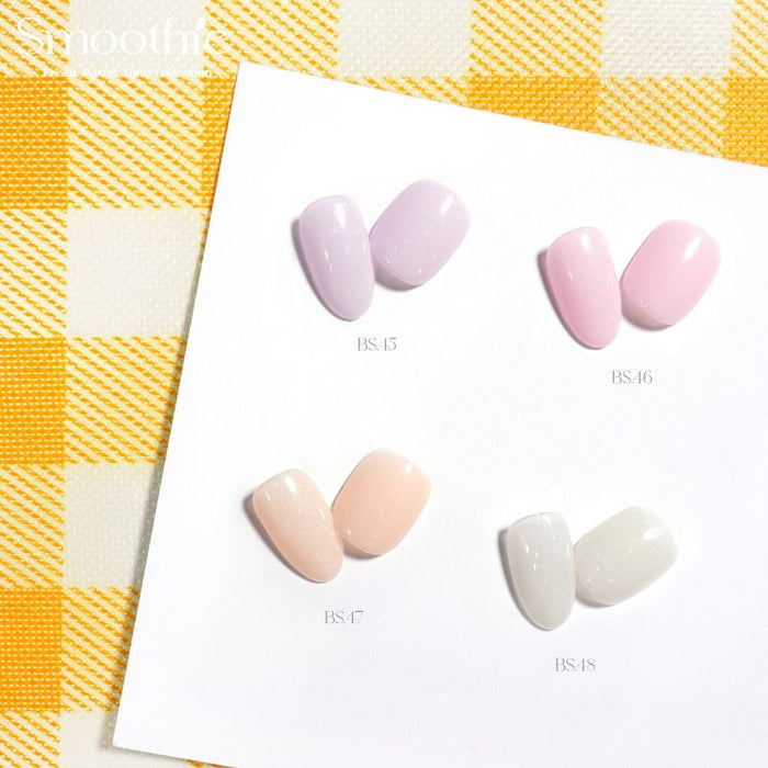 Four pastel nail color swatches from the Smoothie Fresh Pastel Tone Collection by BY MUSE, displayed on a white card against a yellow checkered background. The colors include BS 45 Light Lavender, BS 46 Pink Lace, BS 47 Tuft Blush, and BS 48 Shape Gray.