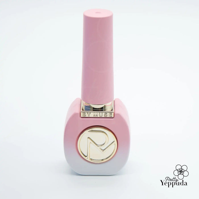 A vibrant and eye-catching nail polish bottle showcasing the "By Muse" brand. The sleek, cylindrical design in a soft, alluring pink hue commands attention, while the metallic logo accent adds a touch of elegance. This 40-piece syrup gel collection from By Muse promises a salon-quality manicure experience, delivering a diverse range of shades and finishes to suit any style.