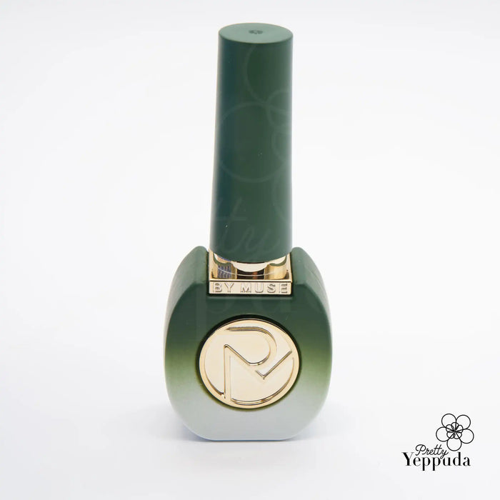 A beautiful, minimalist green nail polish bottle with the "By Muse" logo prominently displayed. The bottle showcases the essence of the "Be My Muse" 40-piece syrup gel collection, offering a sleek and sophisticated design that captures the brand's essence. The product description highlights the collection's HEMA-free formula and compatibility with 60s UV/LED curing, making it an appealing choice for discerning nail enthusiasts.