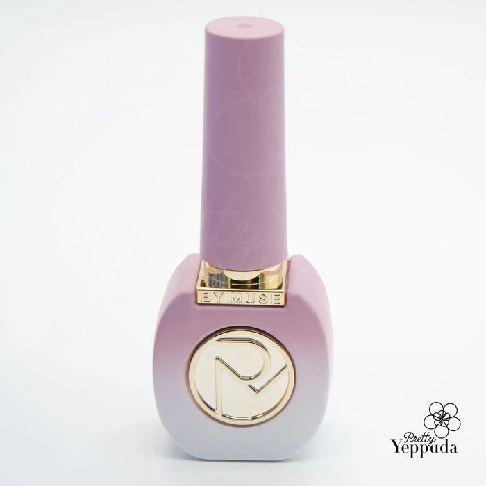 Enchanting fairy tale inspired nail polish bottle in a delicate lavender shade, capturing the essence of a spring garden with its whimsical floral design and elegant gold accents, a captivating offering from the renowned By Muse Fairy Tale Collection.