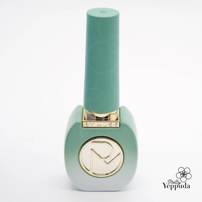 Vibrant and nature-inspired nail polish bottle in a captivating mint green shade, with a gold-accented design symbolizing the enchantment of the "Fairy Tale" collection by the premium brand By Muse, capturing the essence of a lush spring garden.