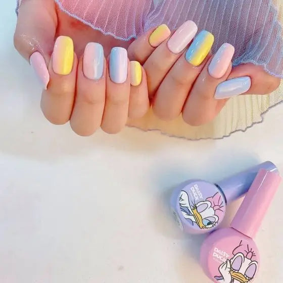 Vibrant, pastel-colored manicure featuring a Daisy Duck-inspired nail polish collection, showcasing a variety of soft, buildable gel polish shades in a harmonious color palette.