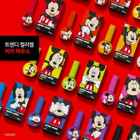 A collection of colorful Disney Mickey Mouse gel polish bottles, showcasing the diverse range of shades and designs inspired by the iconic character. The image highlights the DGEL Disney Mickey Mouse Collection, which offers a buildable formula and a smooth application for an opaque finish, with the products being 14-free and HEMA-free.