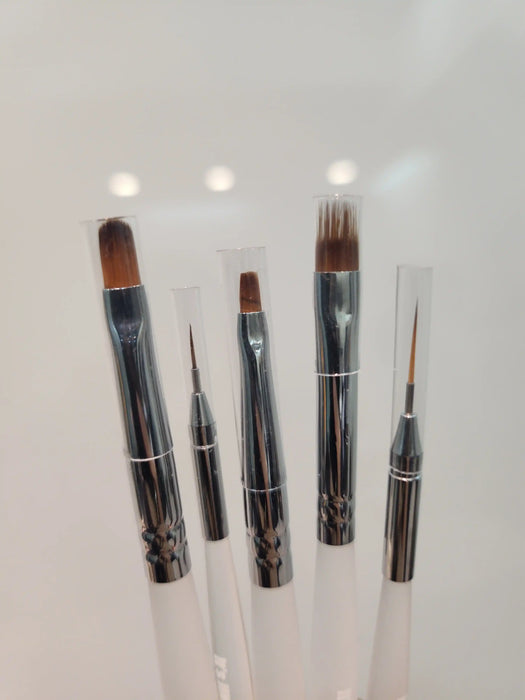 A diverse collection of high-quality nail art brushes suitable for both beginners and professionals, featuring a variety of brush types and sizes for precise and controlled application of nail gel and other nail products. The DGEL X JINI Nail Brush Set includes a complementary leather pouch for convenient storage and portability.