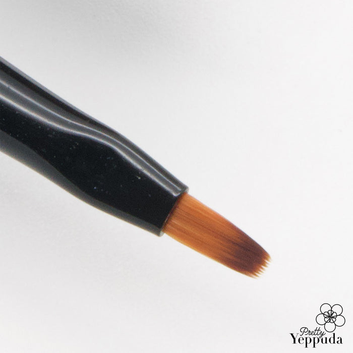 Flexible and versatile JELLO JELLO makeup brush with a tapered brush point, perfect for detailed application, drawing, and precise application of cosmetics. This high-quality, durable brush offers superior control and blending capabilities for a flawless, professional makeup look.