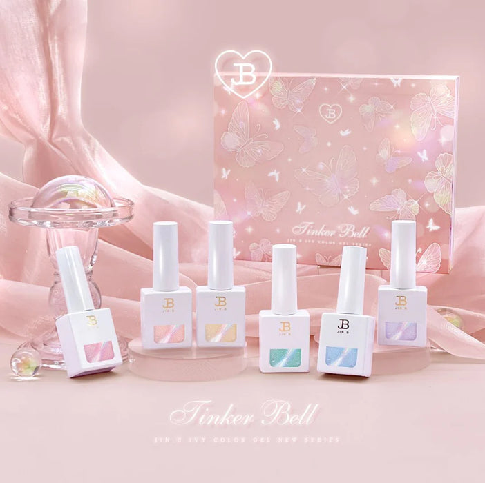 An enchanting collection of Jin.B's Tinker Bell-inspired magnetic cateye gel nail polishes, available in a set of 6 sparkling shades that resemble the magical touch of a fairy's wand. The glass-like syrup base and shimmering hues will transform your nails into a whimsical fairy-tale fantasy.