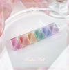 Vibrant and enchanting JIN.B Tinker Bell Cateye Gel Set showcases a rainbow of iridescent nail gel shades, each promising a mesmerizing, glass-like finish that captures the whimsical essence of fairy magic. This captivating product set invites users to indulge in a truly magical nail care experience.