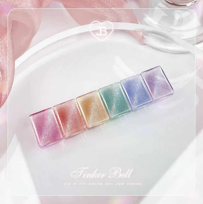 Vibrant and enchanting JIN.B Tinker Bell Cateye Gel Set showcases a rainbow of iridescent nail gel shades, each promising a mesmerizing, glass-like finish that captures the whimsical essence of fairy magic. This captivating product set invites users to indulge in a truly magical nail care experience.