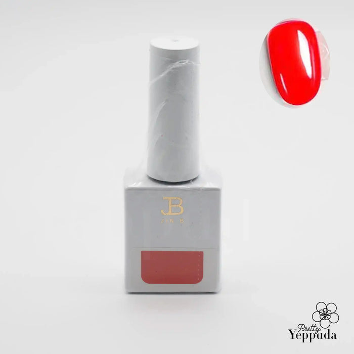 Elaborative alt text describing the image: A white gel nail polish bottle with the JIN.B brand name prominently displayed. The bottle contains a vibrant, deep red nail polish color, hinting at the "IVY Yo So Sexy 6pc Collection" product line. The packaging and product design convey a sense of high-quality, luxurious cosmetics, aligning with the JIN.B brand identity.