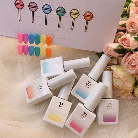 Vibrant and colorful syrup gel polishes from the JIN.B Candy Pop Collection, showcasing a set of 6 bottles in various pastel shades. The image highlights the diverse range of hues available in this Shopify product, providing a visually appealing and enticing representation of the high-quality nail care offering.