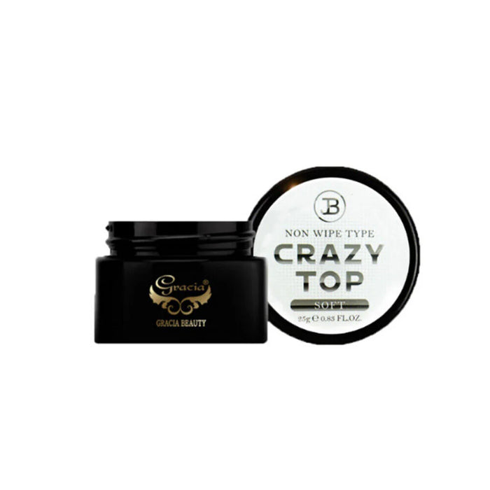 The image shows a black jar containing a non-wipe clear top gel product called "JIN.B Crazy Top Soft Gel - 25g". The product is described as scratch-resistant, super glossy, and non-yellowing, while offering easy soak-off. It is available in three variants - thick, standard, and soft viscosity. The instructions indicate that the product should be cured for 60 seconds under LED or 120 seconds under UV light.