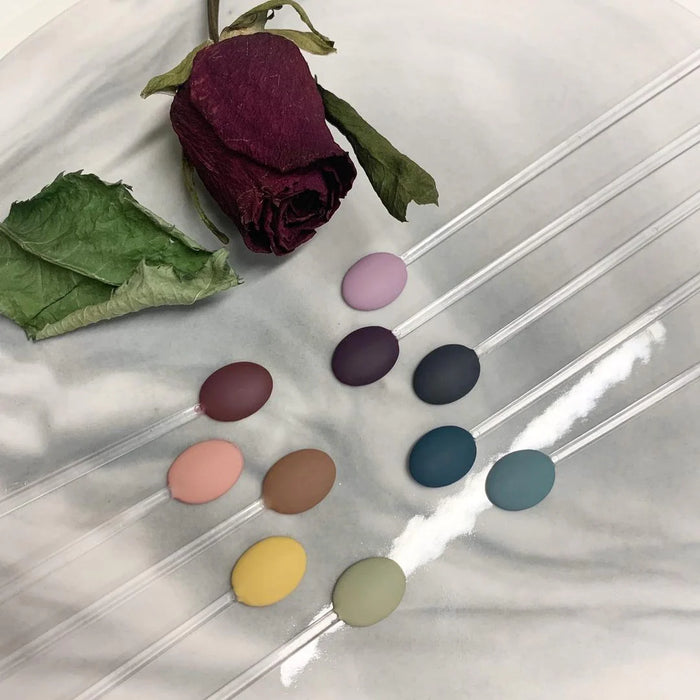 Elegant and enchanting display of the Gracia JIN.B Crescendo Series 10pc Set, showcasing a vibrant array of colorful makeup palettes and a captivating burgundy rose, highlighting the high-quality and diverse range of Gracia JIN.B cosmetic products.