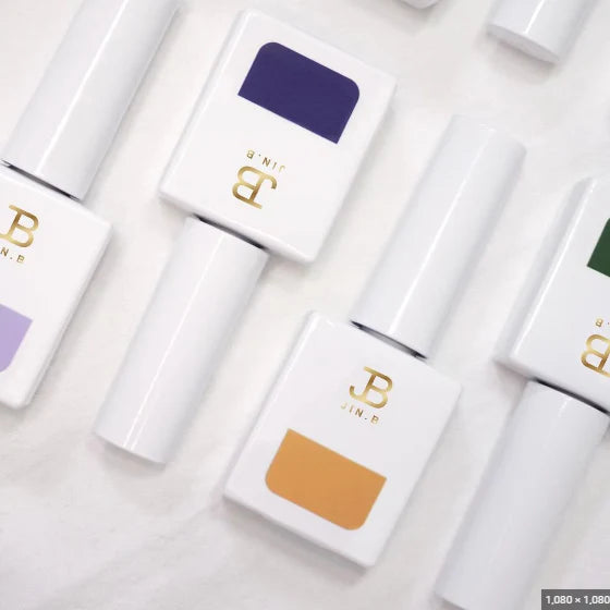 A set of 8 matching color nail polish bottles from the JIN.B Ivy Forte Series, with each bottle containing 11ml of product. The image showcases the sleek, minimalist packaging design featuring the JIN.B brand name and logo.