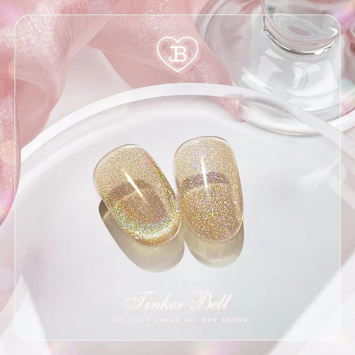 Enchanting glittering gold cateye gel nail set from the Jin.B Tinker Bell collection, showcasing the shimmer and magic of these whimsical nail lacquers.