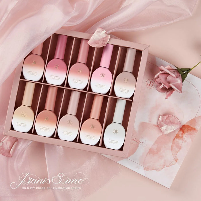 A stunning display of the JIN.B Pianissimo Syrup Gel Set, featuring a collection of 10 expertly crafted gels in a range of premium, flawless colors. This versatile set is suitable for any skin and nail type, offering a convenient and luxurious beauty solution for your daily routine. The elegant packaging and soft, pastel tones evoke a sense of sophistication and refinement, making this product an ideal addition to any JIN.B beauty collection.