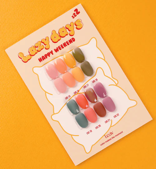 Vibrant and inviting image showcasing the 'LEAV Lazy Days Collection' of 8 sheer, buildable gel polishes in a variety of warm, deep color tones. The swatch card highlights the range of hues available, from earthy neutrals to bold, saturated shades, offering a color palette perfect for relaxed, indulgent manicures.