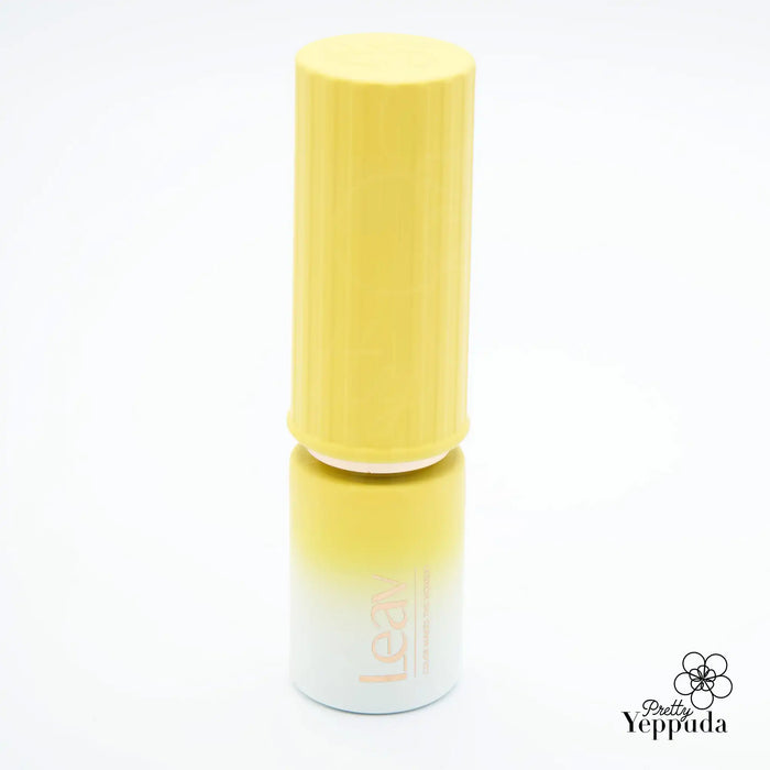 A vibrant yellow LEAV Fanfare Collection gel polish bottle with a unique lipstick-style packaging, showcasing the high-quality formula suitable for salon settings. This playful pastel gel polish is part of an 8-piece collection, each color available as a single gel or as a set, allowing customers to customize their nail care experience.