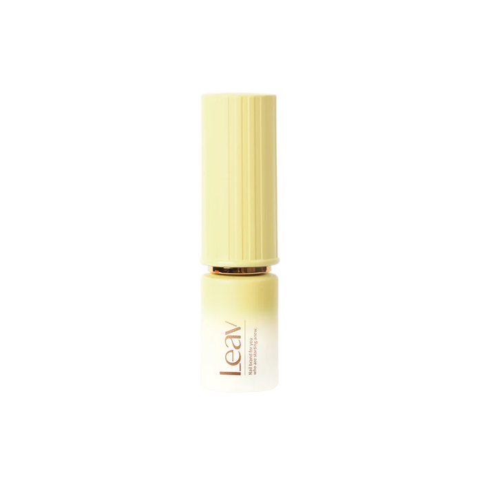 A beautiful pastel colored syrup gel nail polish bottle from LEAV's Fairy Tale Collection, featuring a unique lipstick-style packaging design and a soft, creamy yellow shade that evokes the magic and wonder of a whimsical fairy tale world.