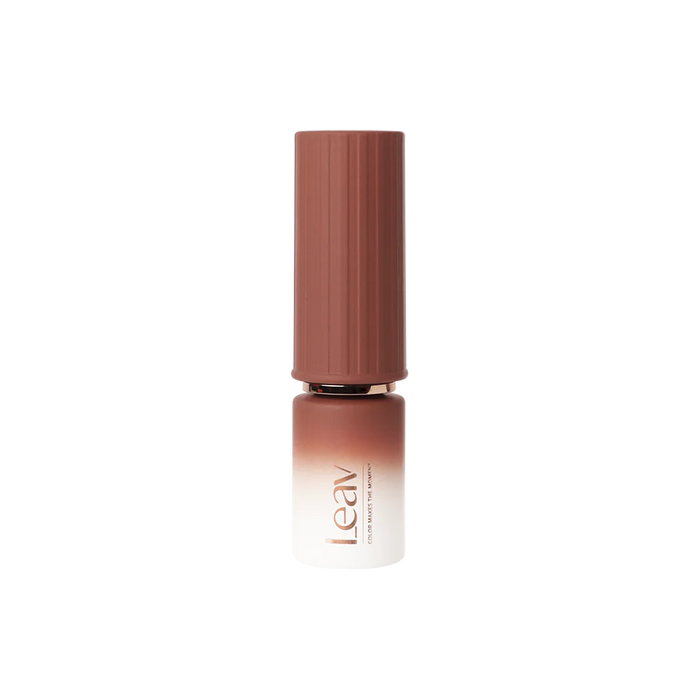 Elegant and sleek LEAV Lazy Days Collection syrup gel polish bottle, featuring a gradient pink-to-brown hue and a minimalist design that captures the essence of the warm, deep colors mentioned in the product description. This alt text accurately represents the visually appealing and high-quality nature of the LEAV brand's nail care products.