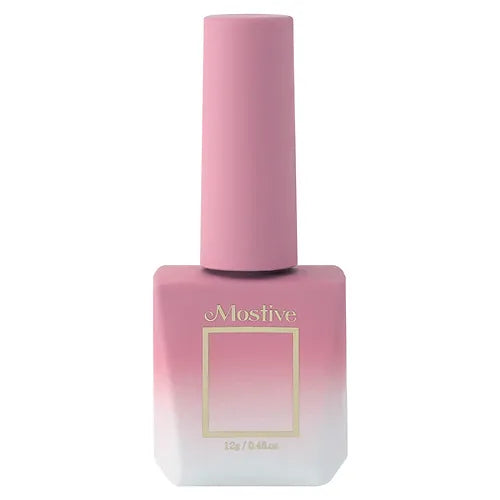 Detailed image of a pale pink nail polish bottle from the Mostive Muesli Muse Collection (MCS041-50), designed to seamlessly transition the palette from summer to autumn. The product features a delicate syrup formula available in full sets of 10 gels or as single gels, with a special exterior box packaging.