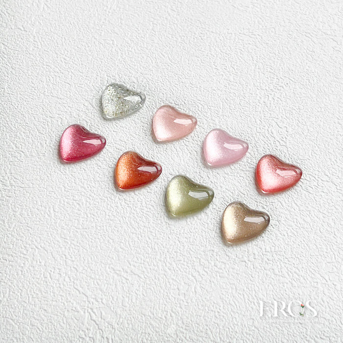 Vibrant heart-shaped gel nail polish bottles in an array of captivating colors, showcasing the alluring and versatile shades of the MAYO Eros Collection.