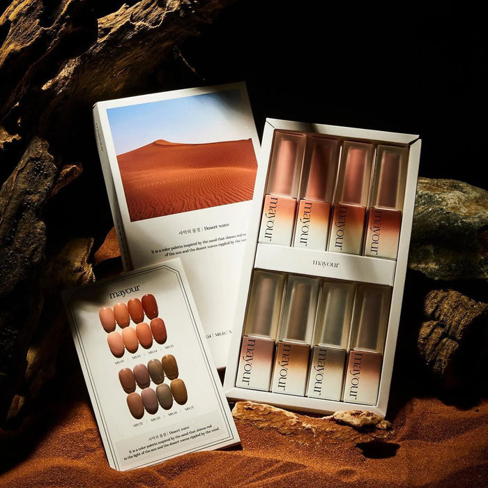 Alluring desert landscape captured in a serene image, showcasing the MAYOUR Desert Wave Collection of gel polishes inspired by the warm, inviting tones of sandy dunes. The set of 8 vibrant shades promises long-lasting, chip-resistant nail art with a glossy finish, allowing nail enthusiasts to transform their looks and experience the captivating allure of the desert.