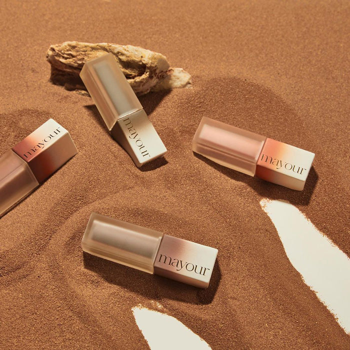 The ALT text for this image of the MAYOUR Desert Wave Collection 8-piece gel polish set could be: "A collection of MAYOUR brand nail polish bottles in warm desert-inspired shades, arranged on a sandy background.